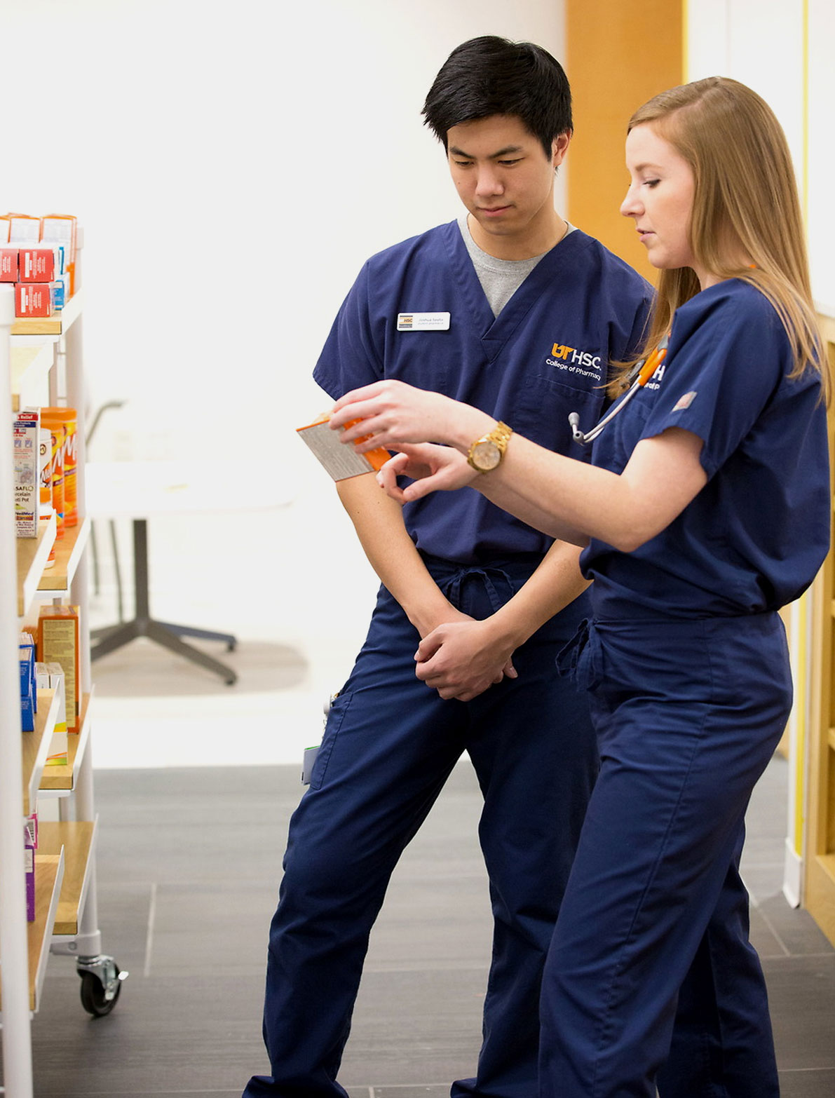 UT pharmacy students inspect medication label