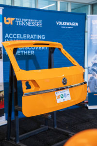 Bright U T Orange liftgate with Volkswagen emblem. The license plate features the logos for U T, O R N L, V W and I A C M I