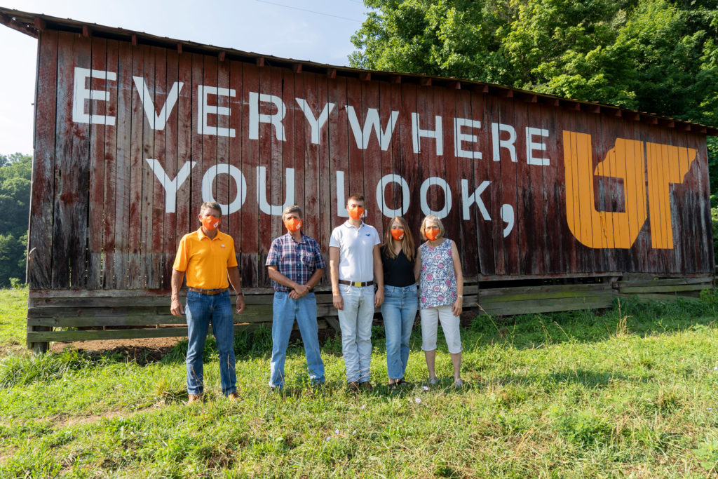 UT President Randy Boyd with the Stone family in front of the completed Bristol barn mural