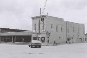 Black and white photo of the Cavelier Men's clothing shop in Fayetteville on the corner of Market and Main