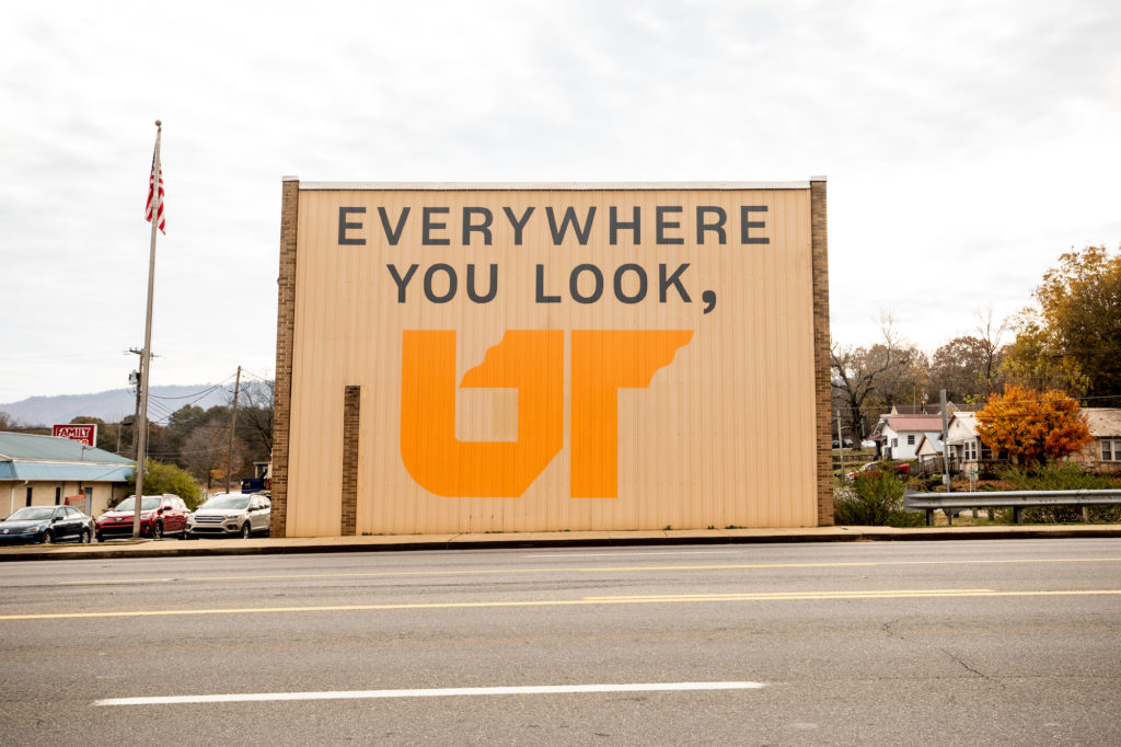 Close-up photo of UT mural on beige building in Polk County