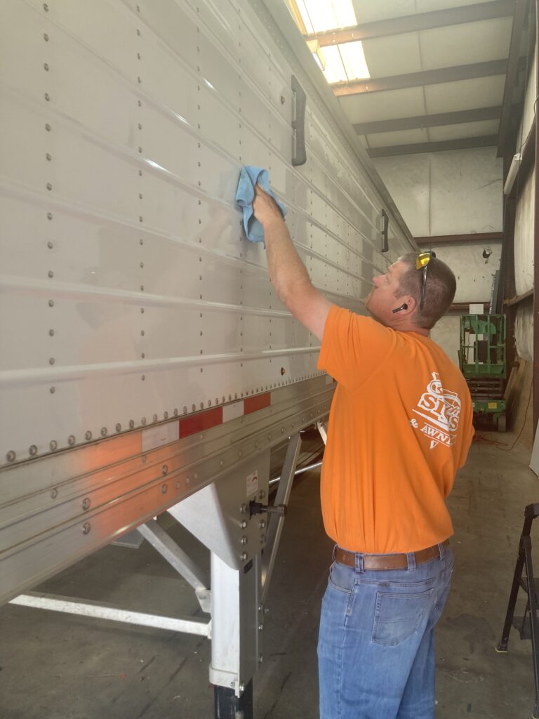 UT mural decal being prepped for a 42-foot trailer by Smith Signs and Awnings in Lawrenceburg, Tennessee